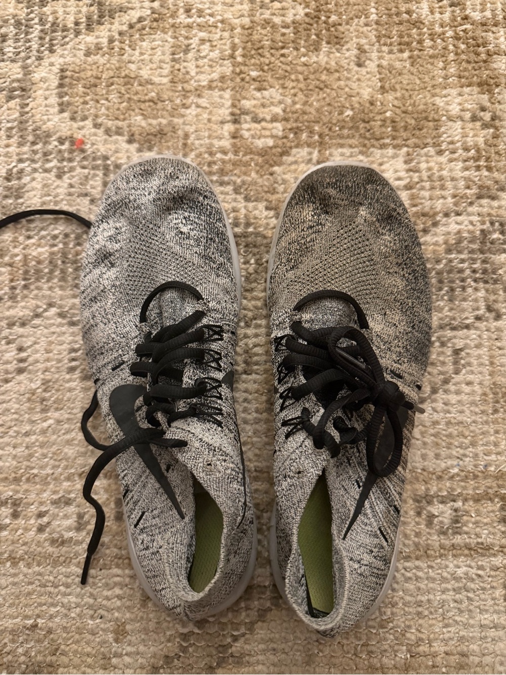 Nike Light Gray Flyknit Sneakers with Black Swoosh